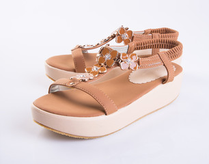 shoe or Brown colour casual woman shoes on a background.