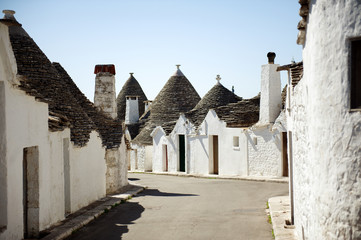 Fototapeta na wymiar Typical trulli buildings with conical roofs in Alberobello, Apulia, Italy