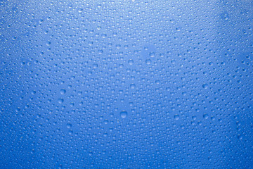 Water drops blue background. Water drops on glass background