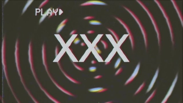 VHS retro fake shot: the text XXX appears over a set of spinning circles  with a lens flare at the beginning. Grindhouse low-budget b-movie style.  Stock Video | Adobe Stock