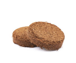 Compressed compost tablet isolated