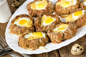 Meat nest with quail eggs and cheese