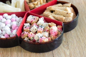 Chinese snacks in tray on the table