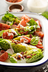Wedge salad with baby lettuce and tomatoes