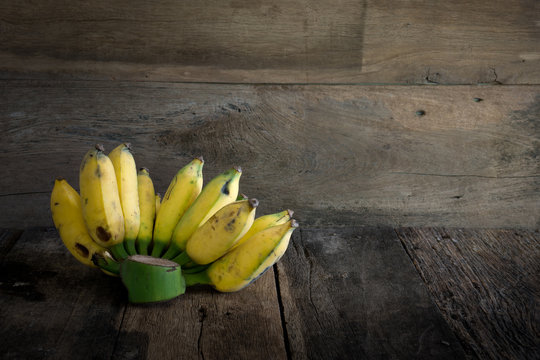 Still life bunch banana on rustic wood