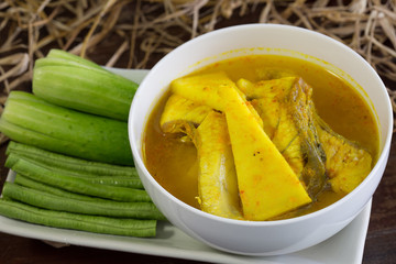 Yellow curry snapper fish with coconut shoots