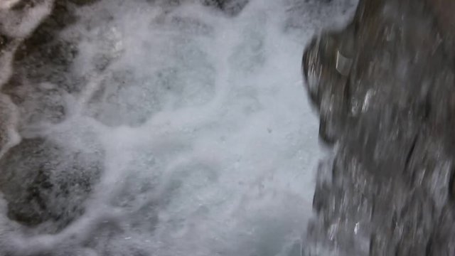 water that falls from the waterfall in the summer