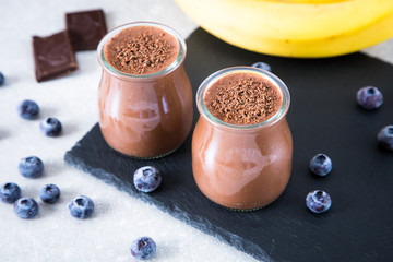 Chocolate banana smoothie with chia seeds and blueberry 