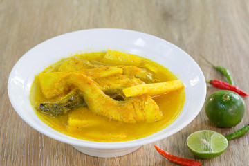 Yellow curry snapper fish with coconut shoots