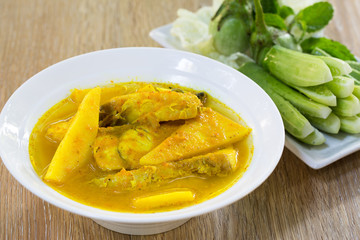 Yellow curry snapper fish with coconut shoots