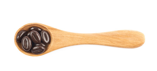 Spoon full of chocolate candies