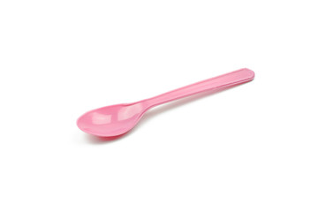 Pink plastic spoon isolated on white background