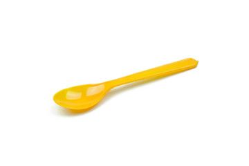 Orange plastic spoon isolated on white background