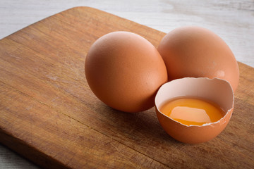 eggs on the board on a wooden background