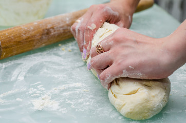 raw dough and rolling pin