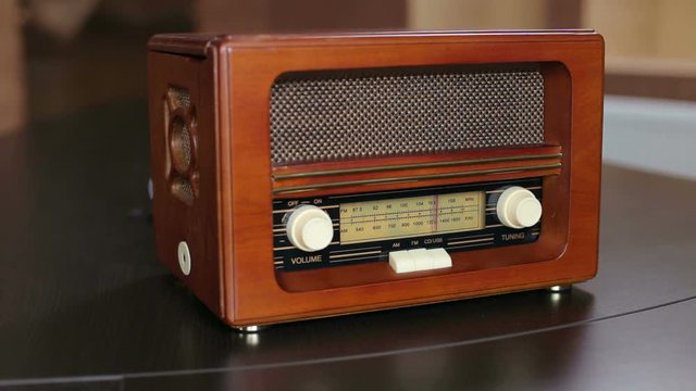Close-up of brown old vintage radio with dials.