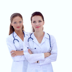Fototapeta premium Two young woman doctor , standing in hospital, isolated
