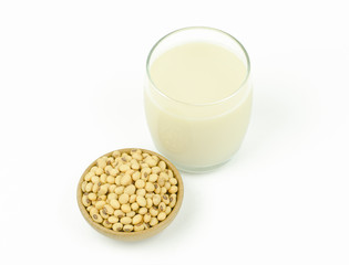 Milk with soy beans on white background.