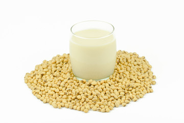 Milk with soy beans on white background.