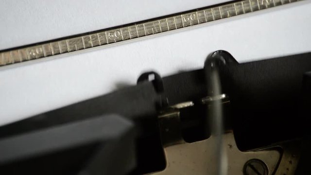 Typing the word Godspeed! with an old manual typewriter