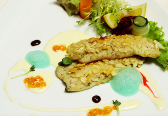 Fried fish fillet under almond