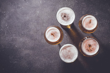 Beer glasses on dark table