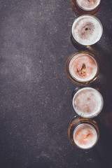 Beer glasses on dark table