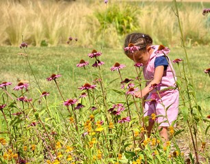 Little girl examining and enjoying nature