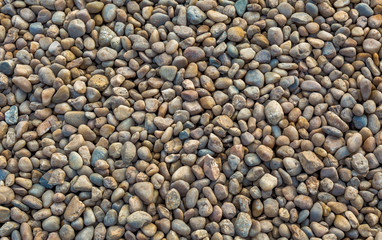 Different color stones pebbles for background texture.