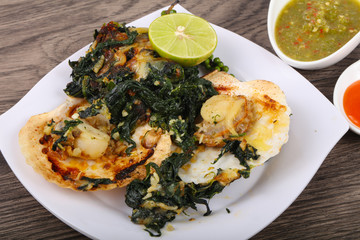 Baked scallops with spinach