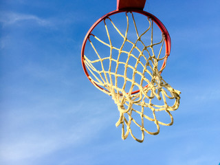Sport playground with basketball ring on blue sky outdoors background
