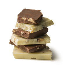 pieces of milk and white chocolate on white background