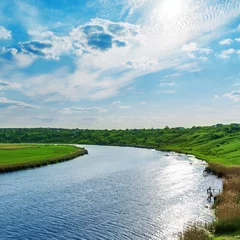 Foto op Canvas sun with clouds in blue sky over river © Mykola Mazuryk