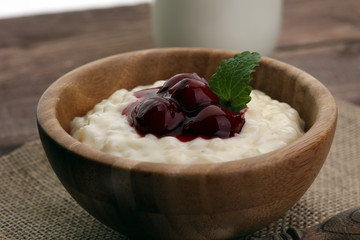 Milk rice pudding with hot cherries