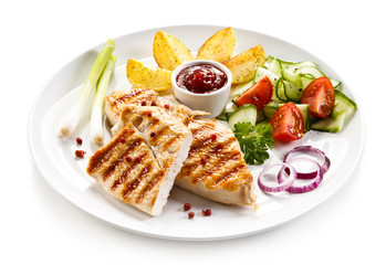 Grilled chicken fillet, chips and vegetable salad 