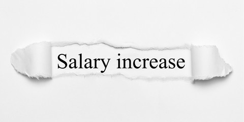 Salary increase auf weißen gerissenen Papier
