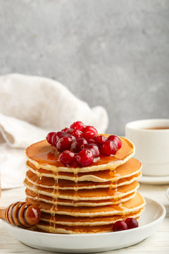 Pancake with honey and fresh berries. Cranberry, cowberry. Gourm
