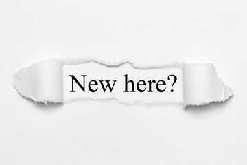 New here? on white torn paper
