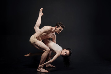 Inspired athletes demonstrating their flexibility in the studio