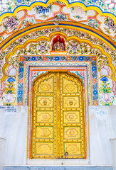 Fototapeta na wymiar Gold doors of an Indian temple