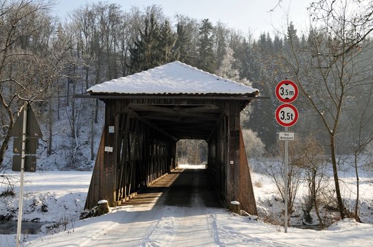 tunnel or wooden bridge cross river at winter