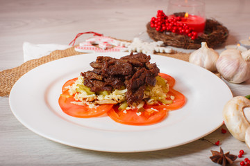 roasted meat with tomatoes on a beautiful decor