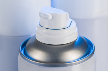 Aerosol spray cans nozzle closeup. Spray cans with shallow depth of field. Air freshener product studio photograph
