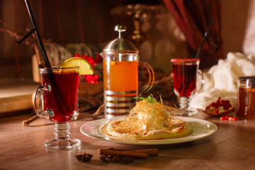 Hot buckthorn tea and mulled wine with decor