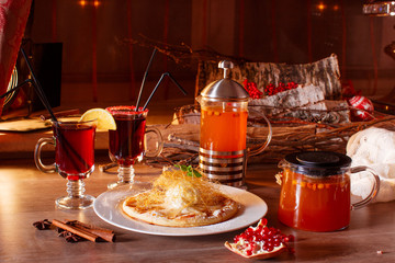 Hot buckthorn tea and mulled wine with decor
