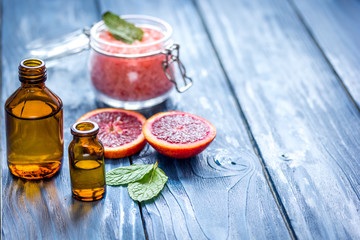 organic cosmetic with citrus on blue background