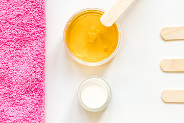 concept depilation with wax on white background top view