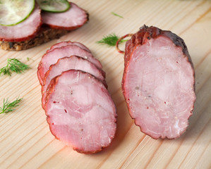 Dried smoked sausage on a wooden board