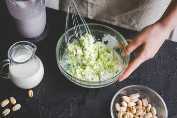 organic ice cream homemade process on dark background with hands