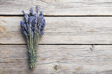 Bunch of lavender flowers on grey wooden background
